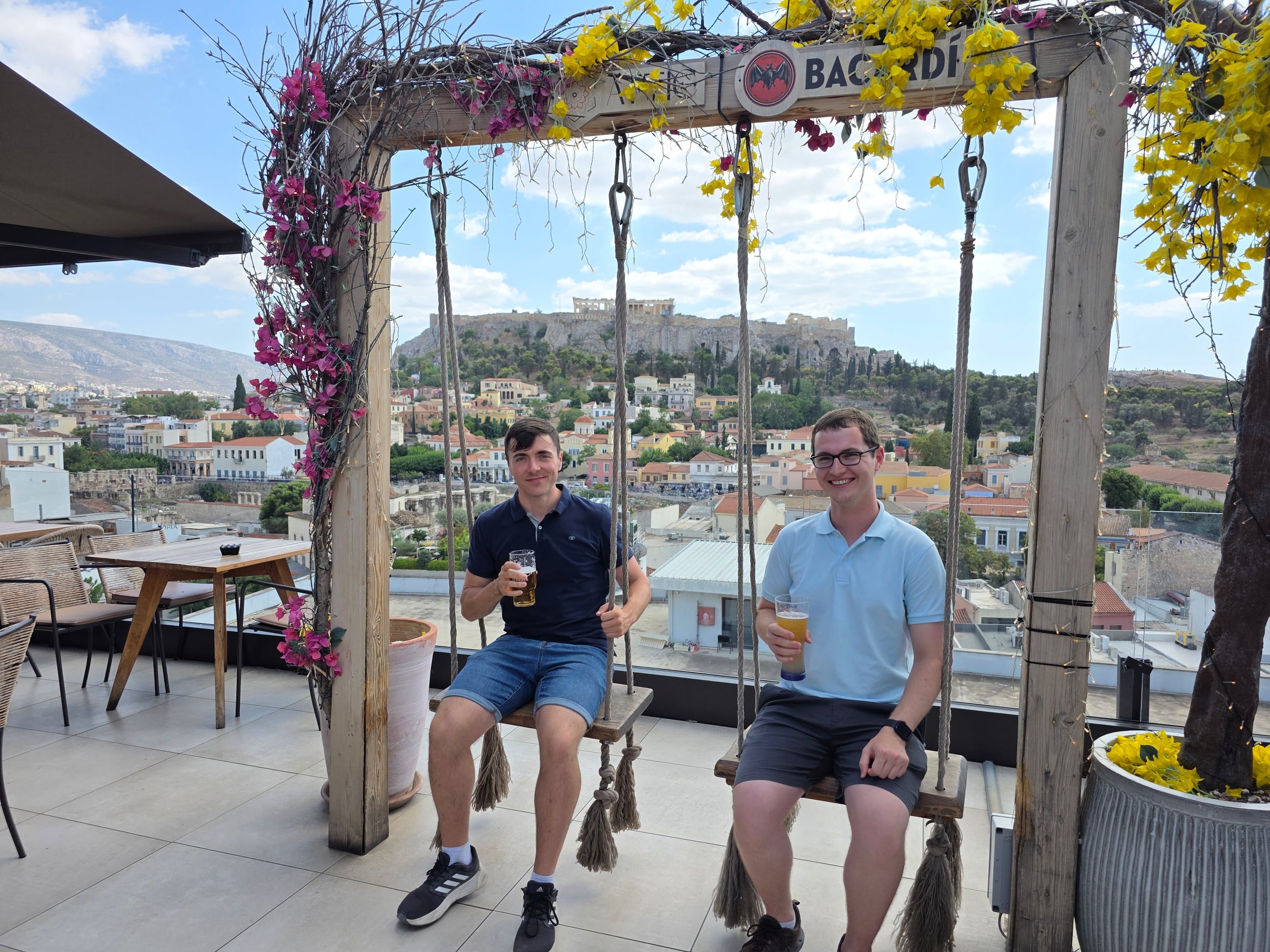 Trying the swings at the rooftop bar.
