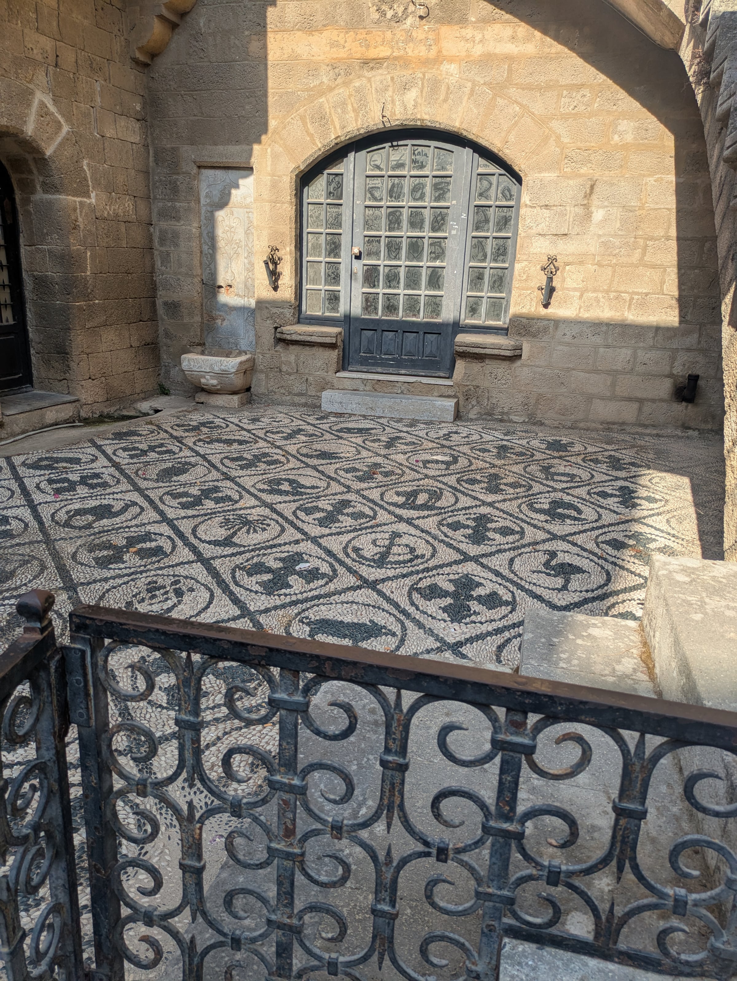 A patterned courtyard floor in Rhodes.