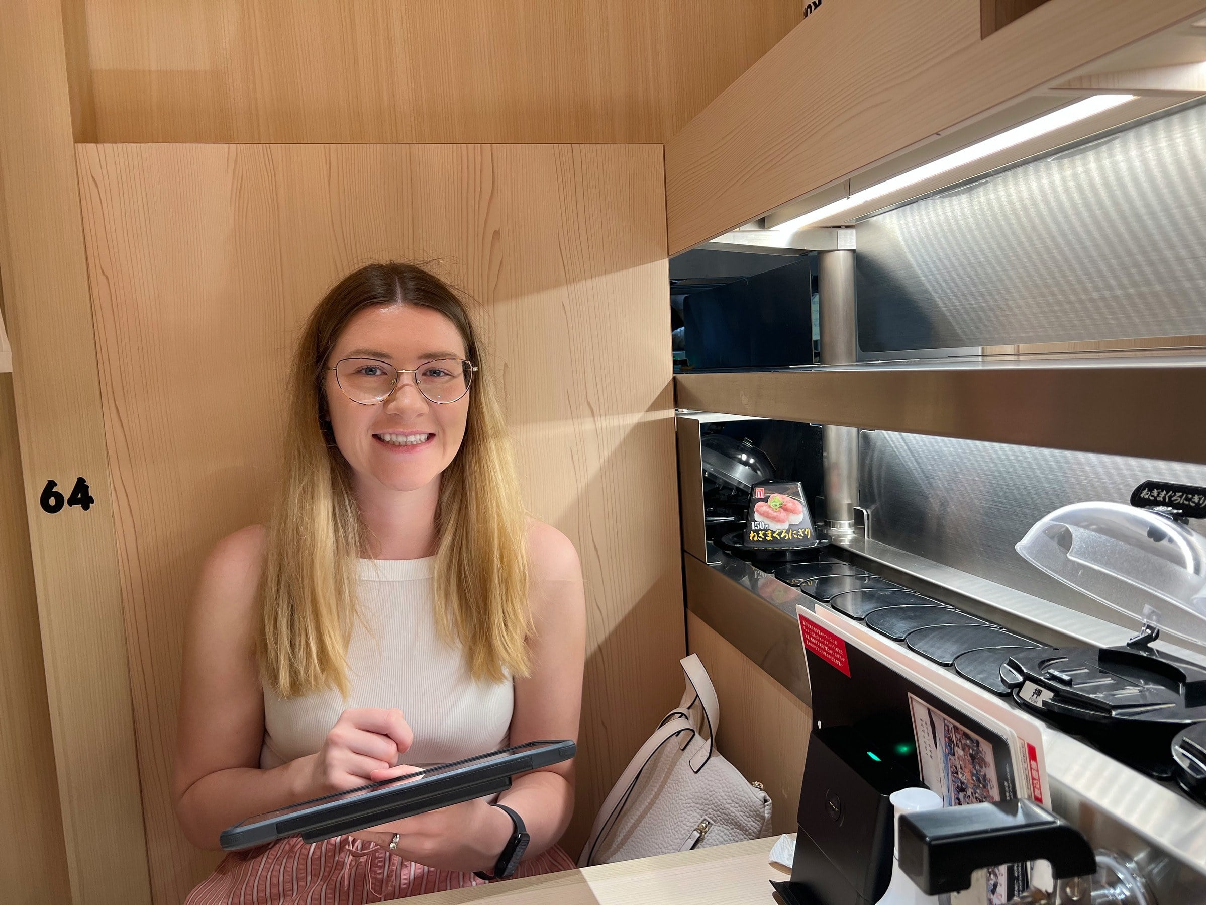 Lucy in our dining booth, beside the delivery track.