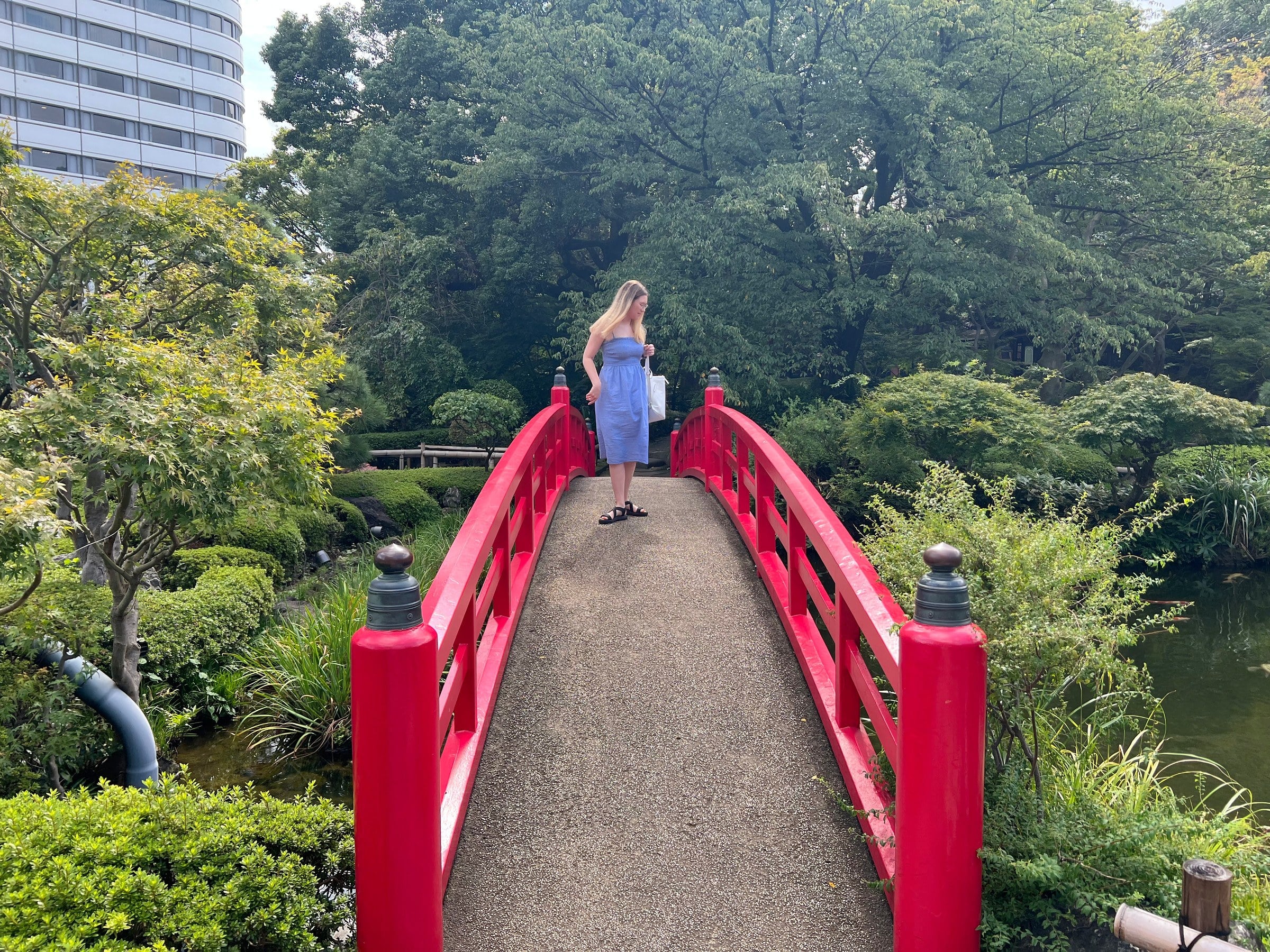Lucy on the red bridge in the New Otani garden.