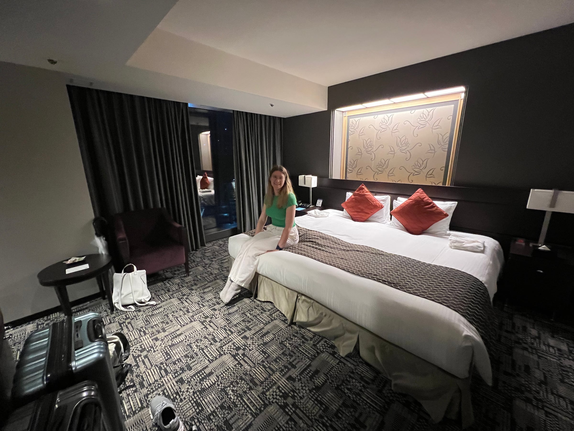 Lucy in our room at New Otani, with its enormous bed.