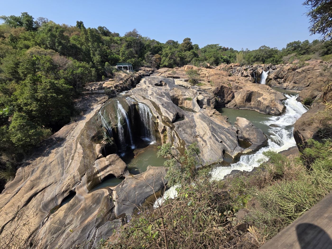 A waterfall over rocks at the Lowveld National Botanical Garden