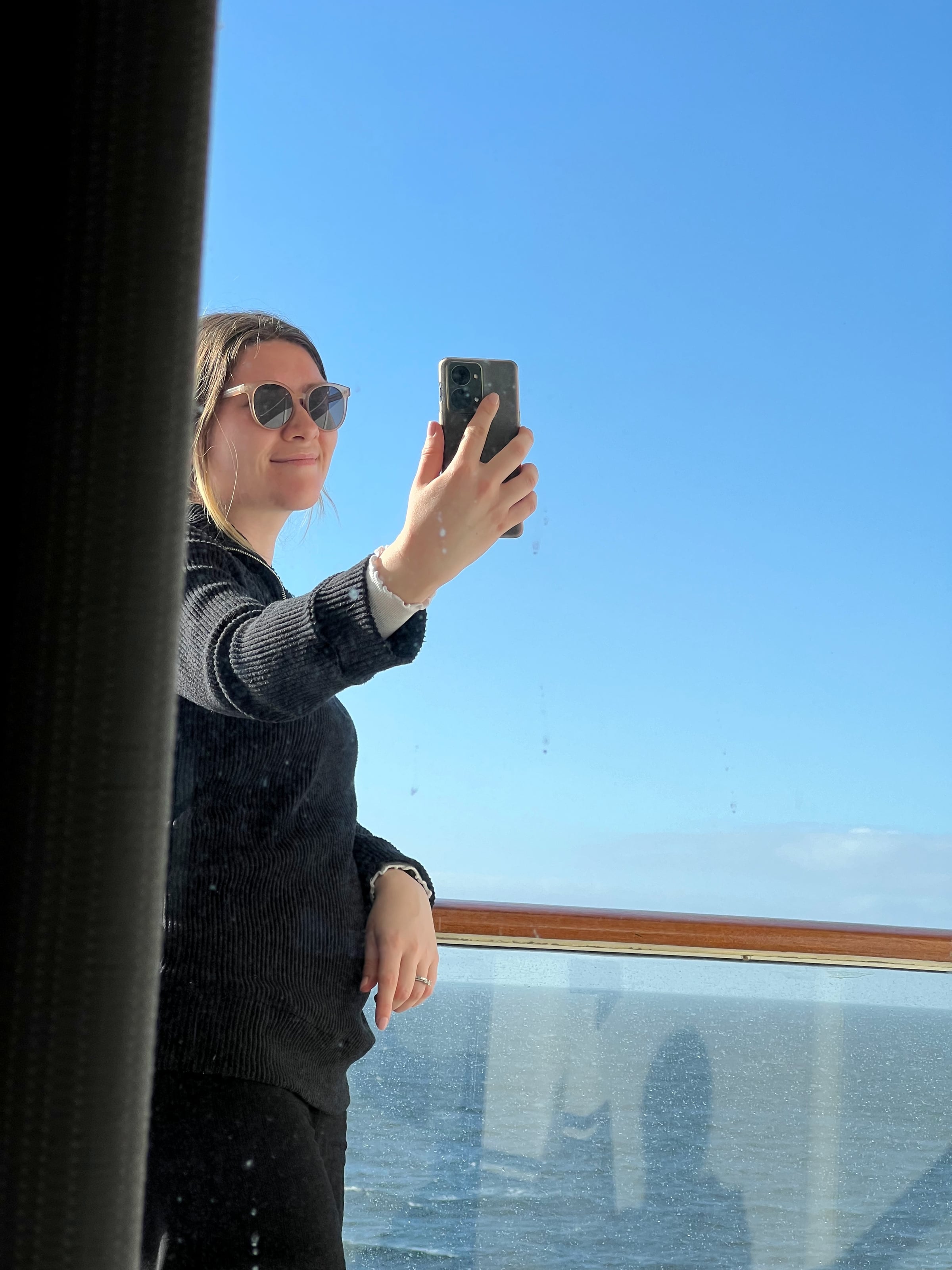 Taking photographs from the balcony as we sailed.