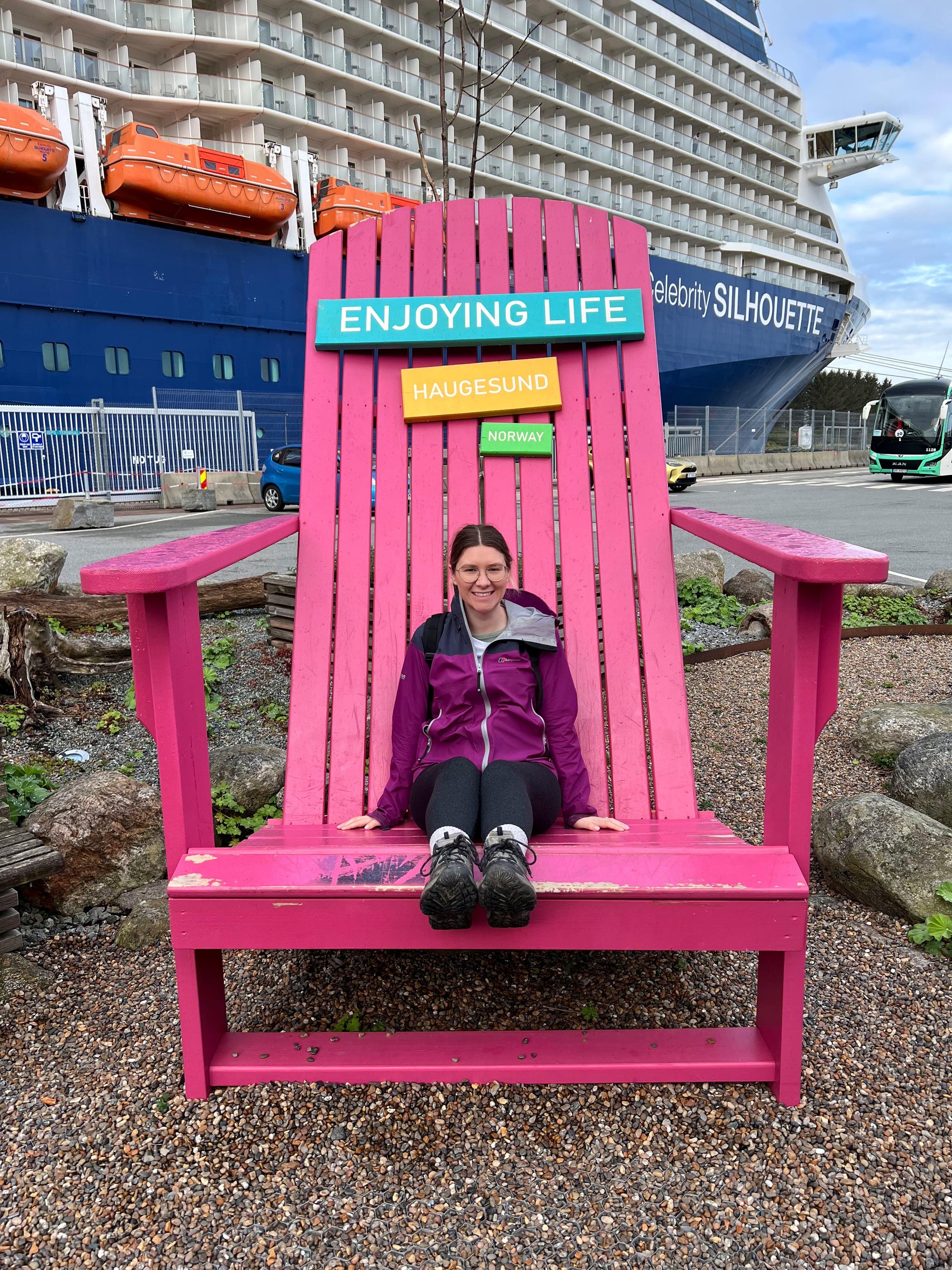 Lucy trying the oversized chair by the port.