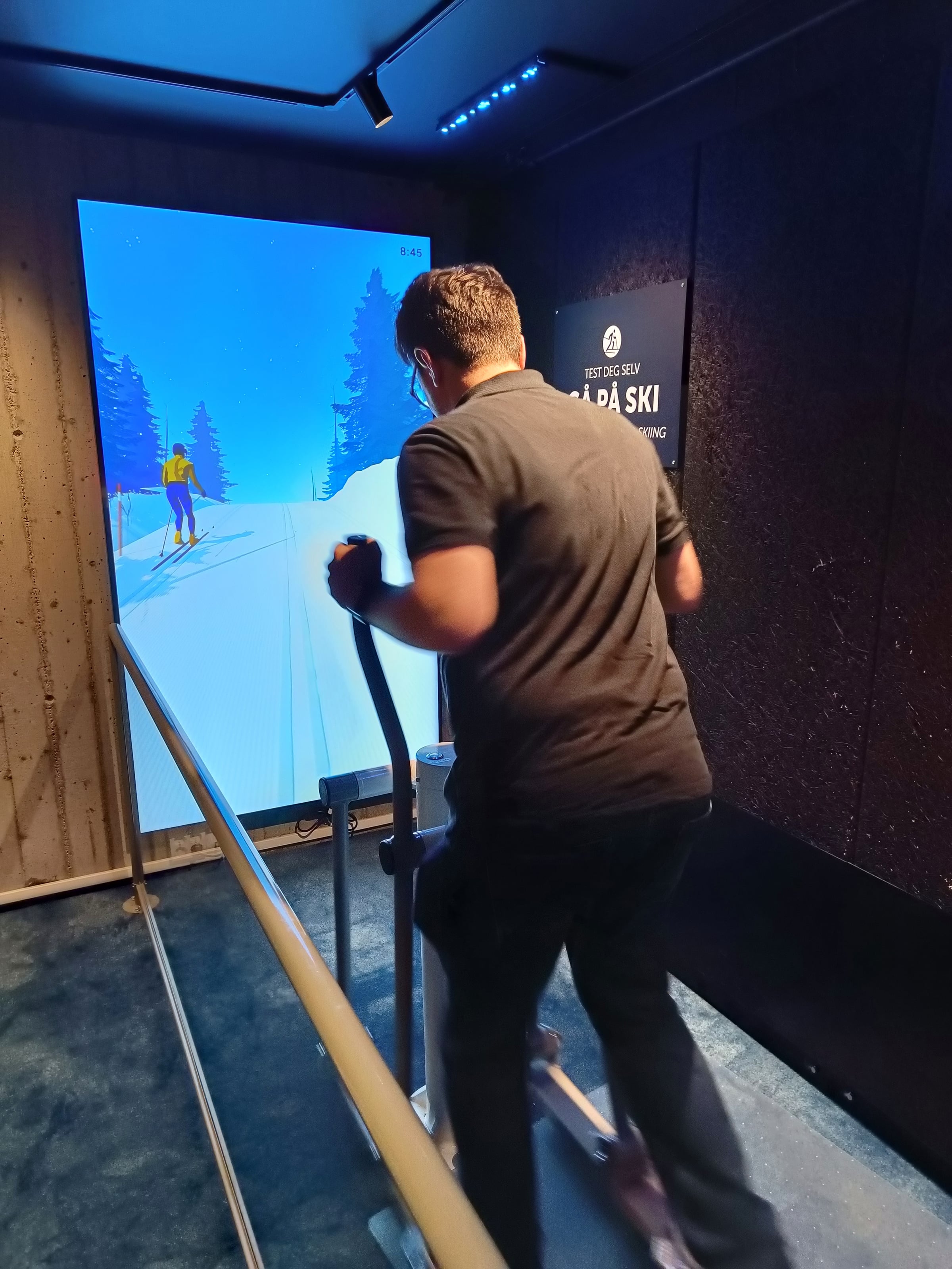 Harry trying the indoor skiing game at Holmenkollen.