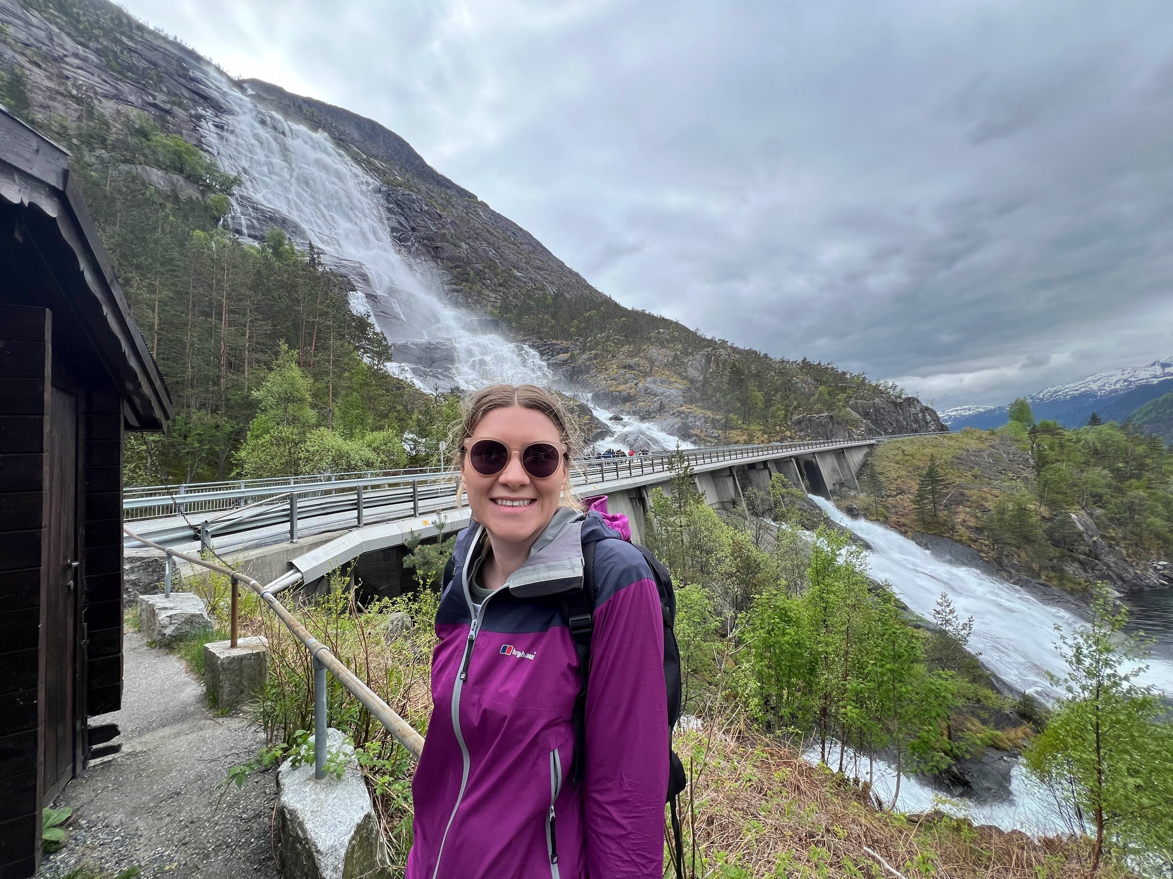 Lucy beside the waterfall at Langfoss.