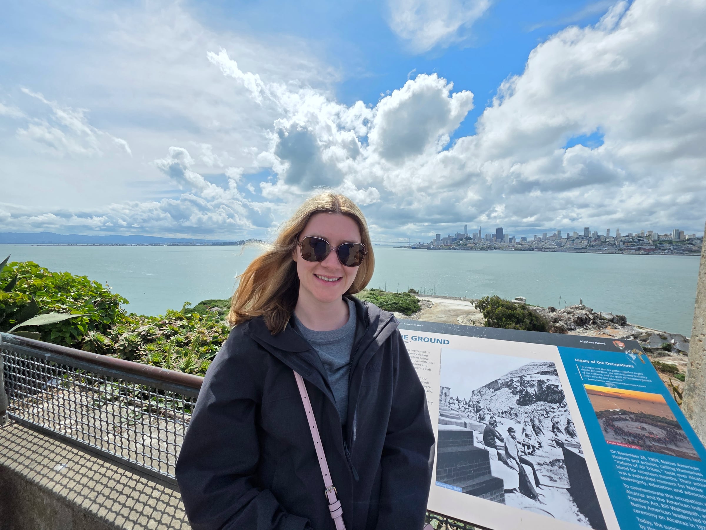 Lucy on Alcatraz, with San Francisco across the water.